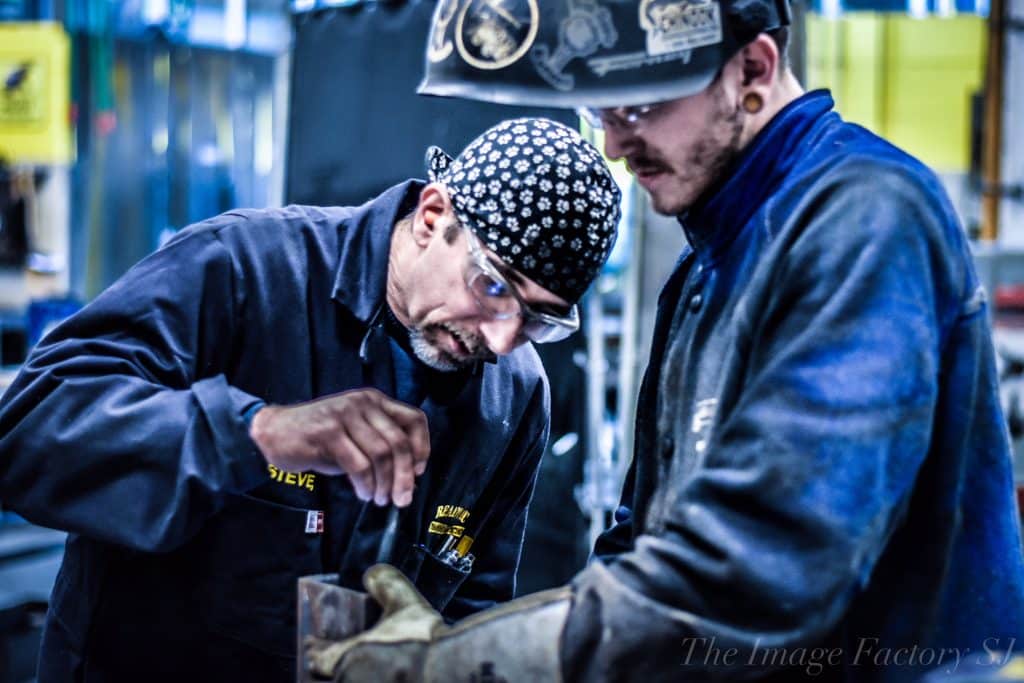 An instructor from Ready Arc Training and Testing administers welder testing,